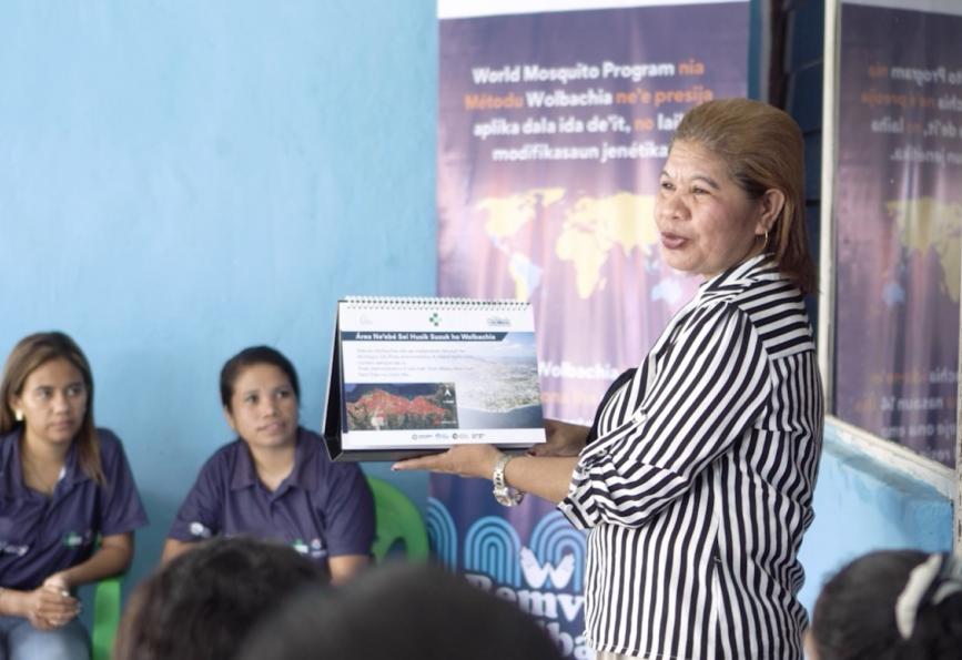 Picture of Afliana Soares talking to a group of community members in Timor-Leste 